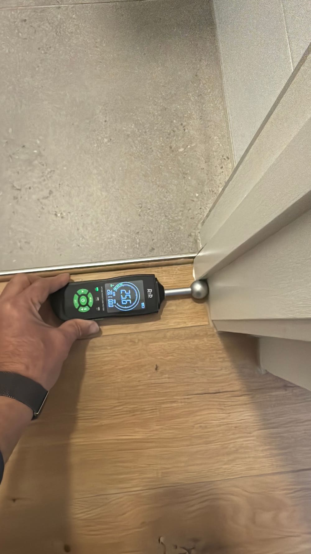 Moisture meter reading on the floor outside a toilet, found during a moisture inspection in Pascoe Vale