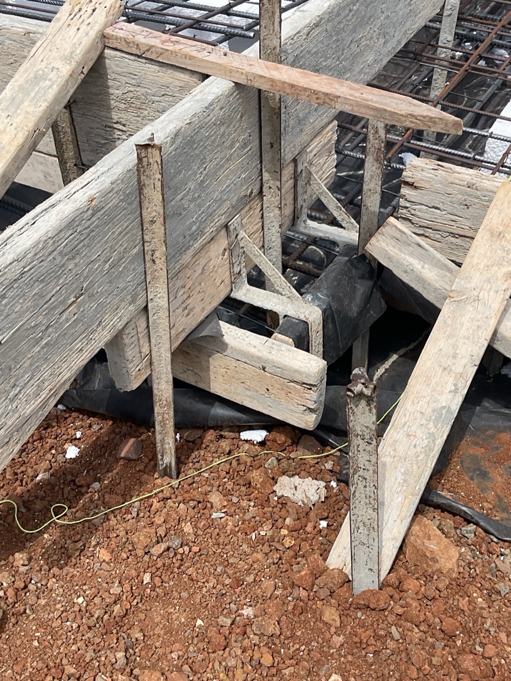 Vapour barrier lying over the steel instead of beneath it, noted during a slab pre-pour inspection in Melton South