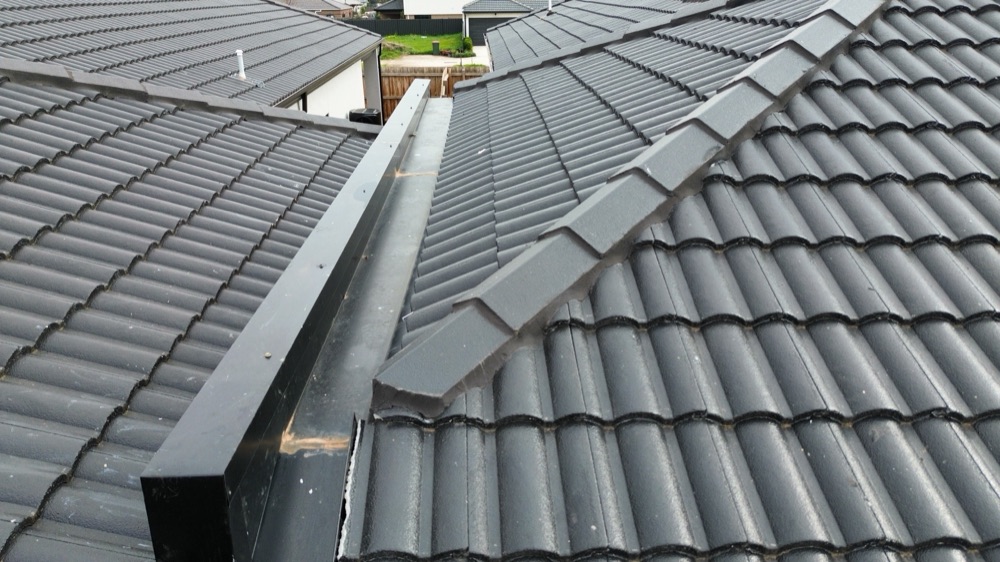 Cappings fixed to the frame from above, noted during a pre-handover inspection in Melton South
