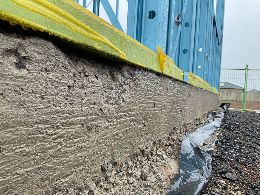 Bottom plates overhanging the slab by more than 10mm, noted during a frame inspection in Melton South